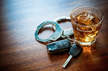 car keys with glass of alcohol