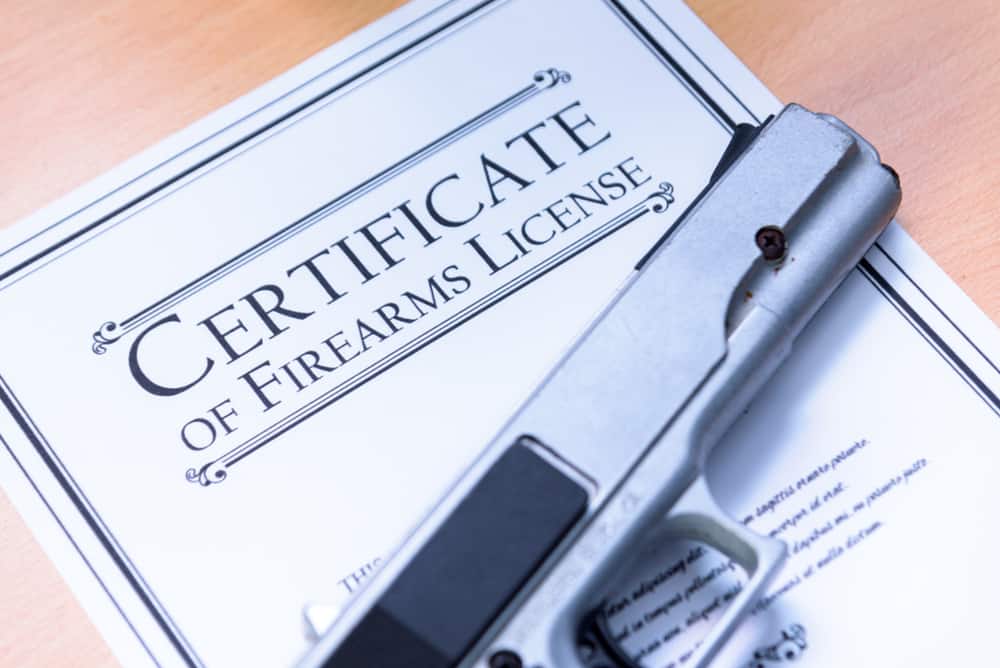 Hangun laying on a Gun / Firearms License Certificate
