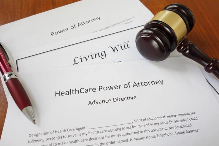 Healthcare Power of Attorney, Living Will and Power of Attorney documents with gavel